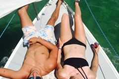 Couple Relaxing on a Sailboat in Key Largo Florida by Kelsi Berlin