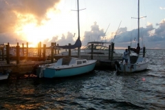 Docking the Boats after a Good Day of Sailing on Buttonwood Sound - by Verner Canatsey